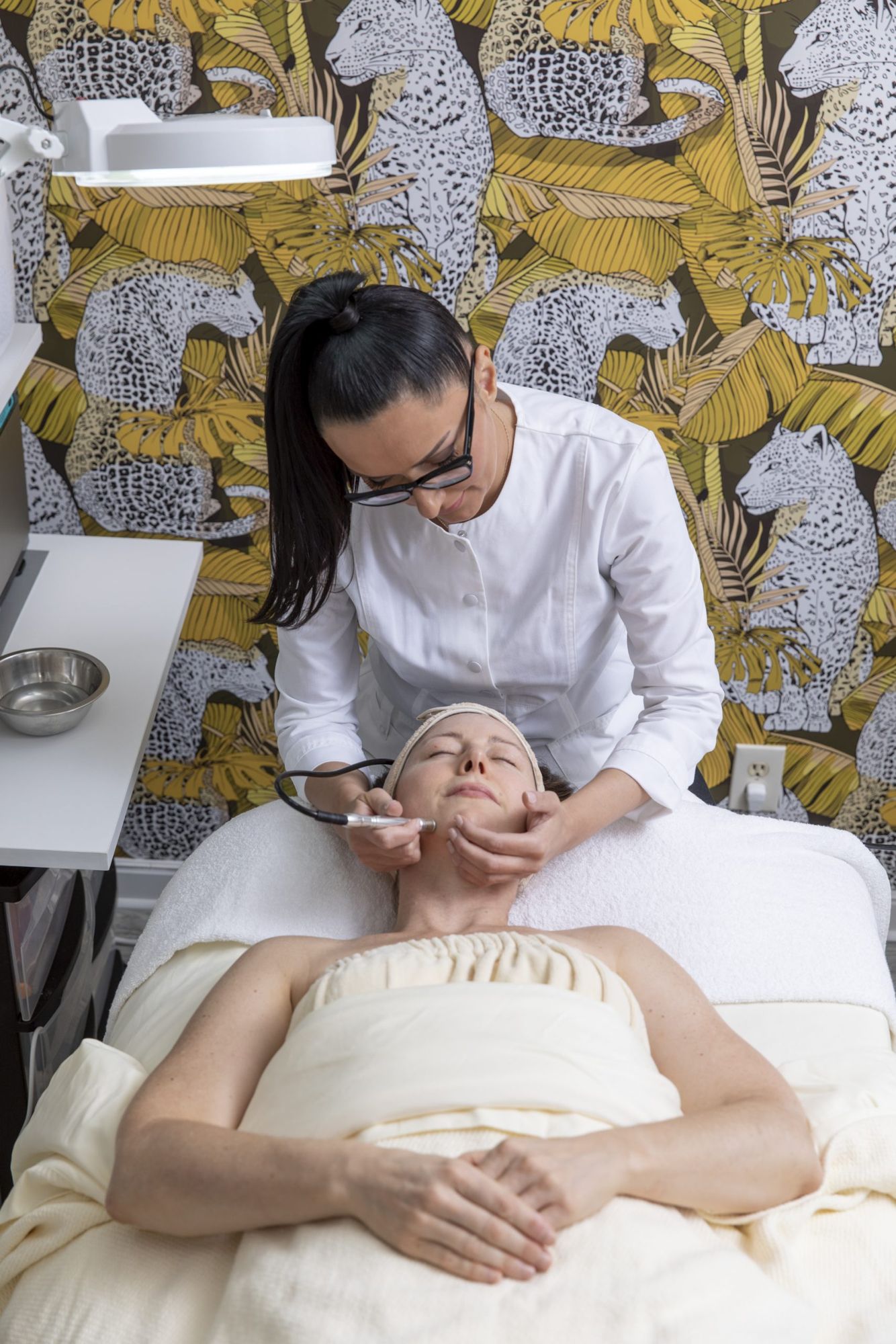 Elena performing a facial in the leopard room